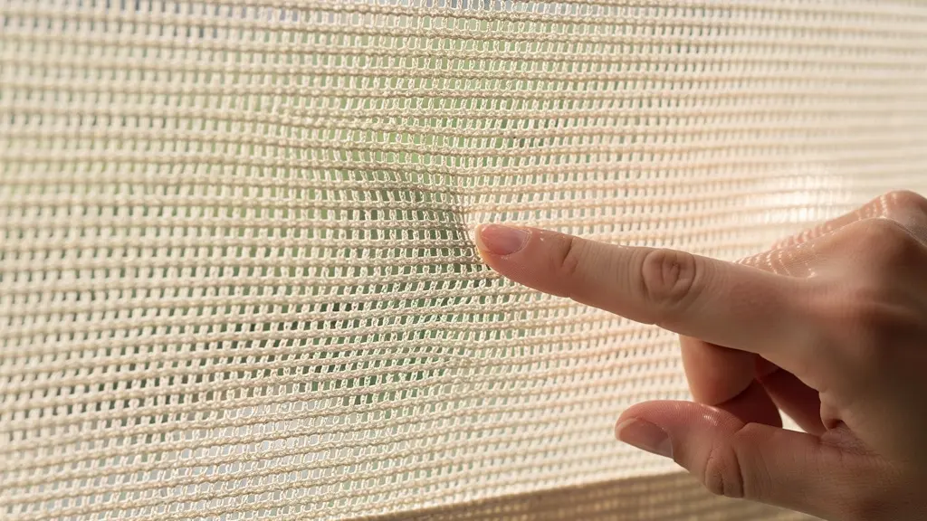 Textura de tejido acrílico para toldo mostrando trama resistente